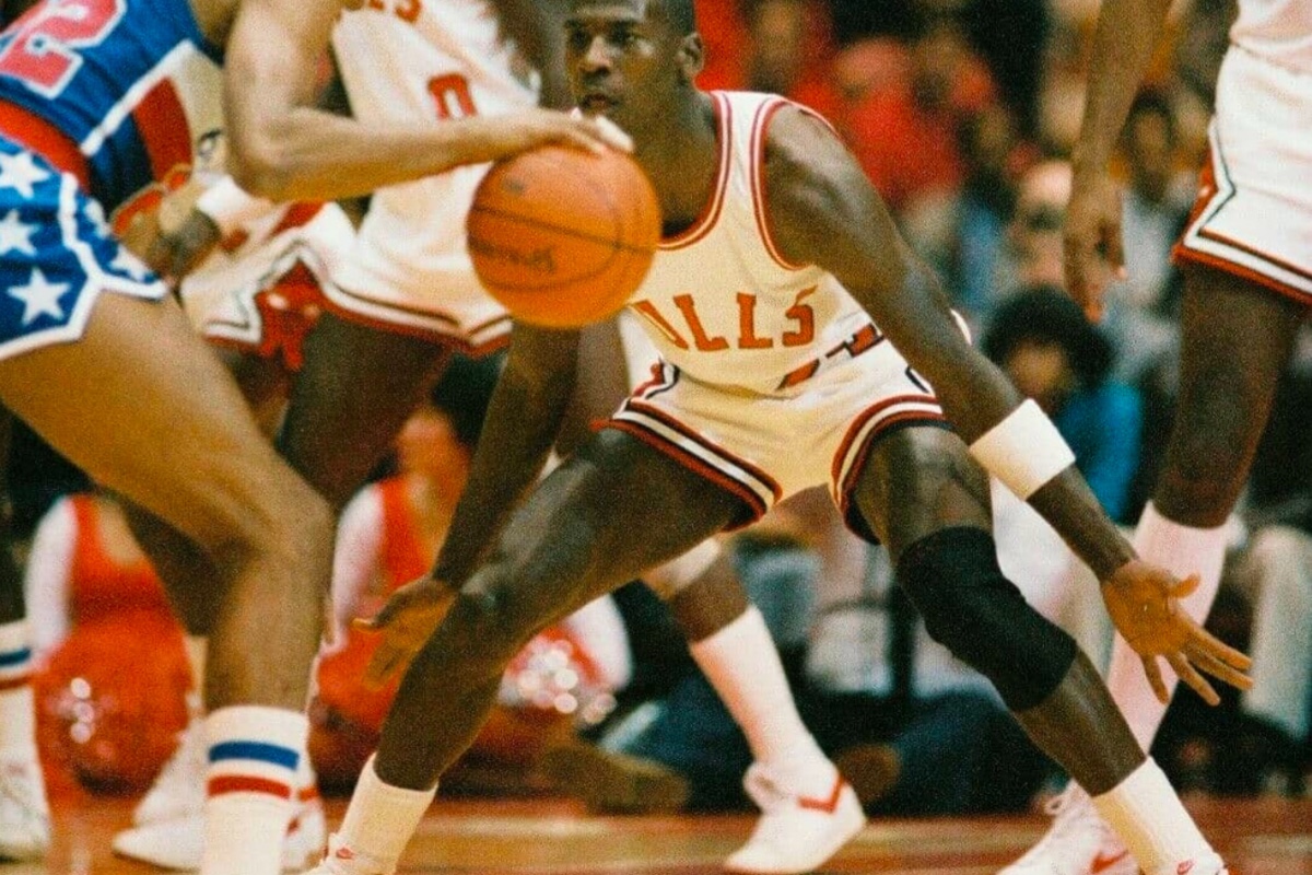 Michael Jordan wearing white and red Nike Air Ship during the start of the 1984 NBA season