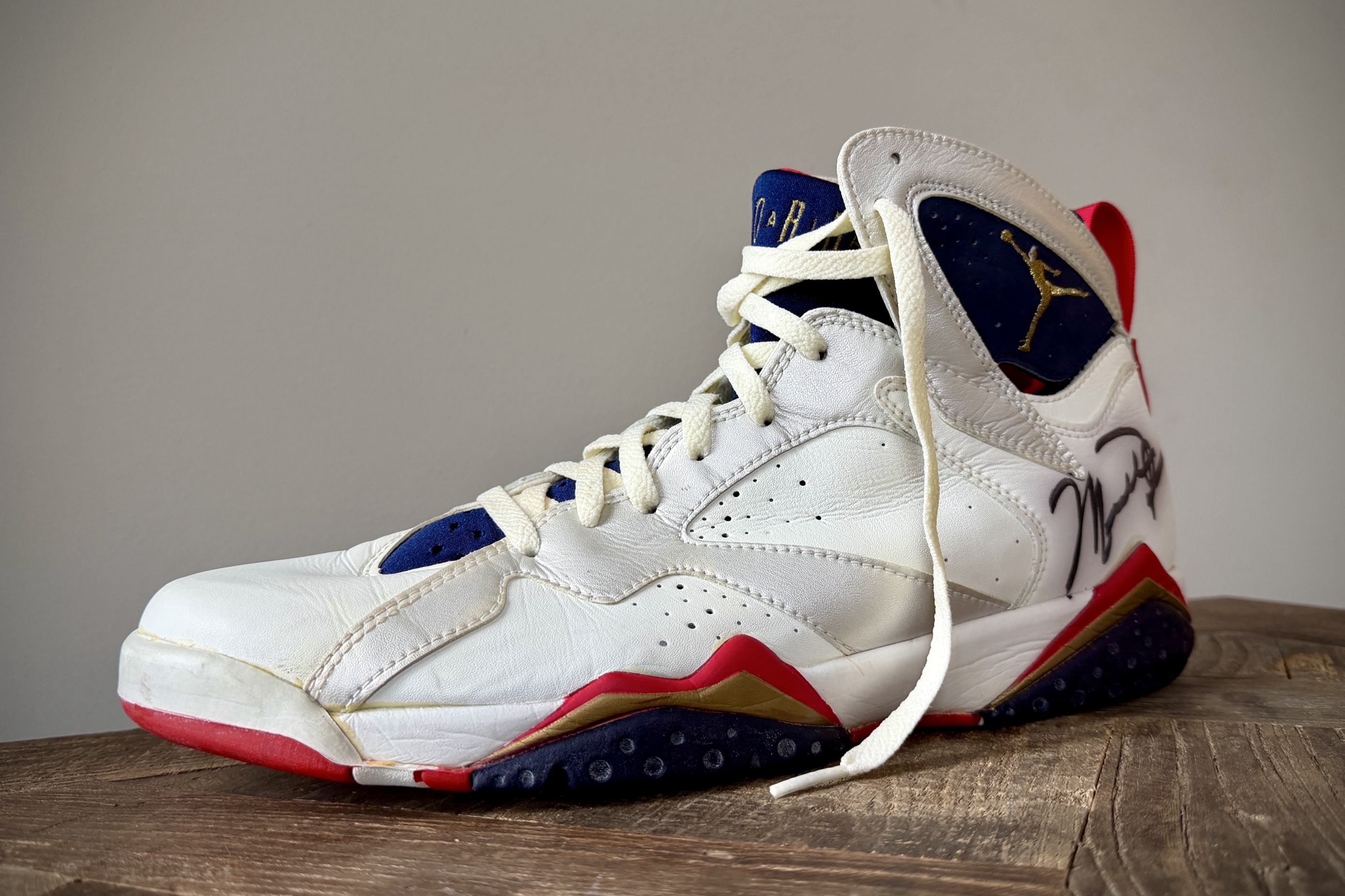 A single Michael Jordan game-worn sneaker photographed at a three-quarter angle with a vignette