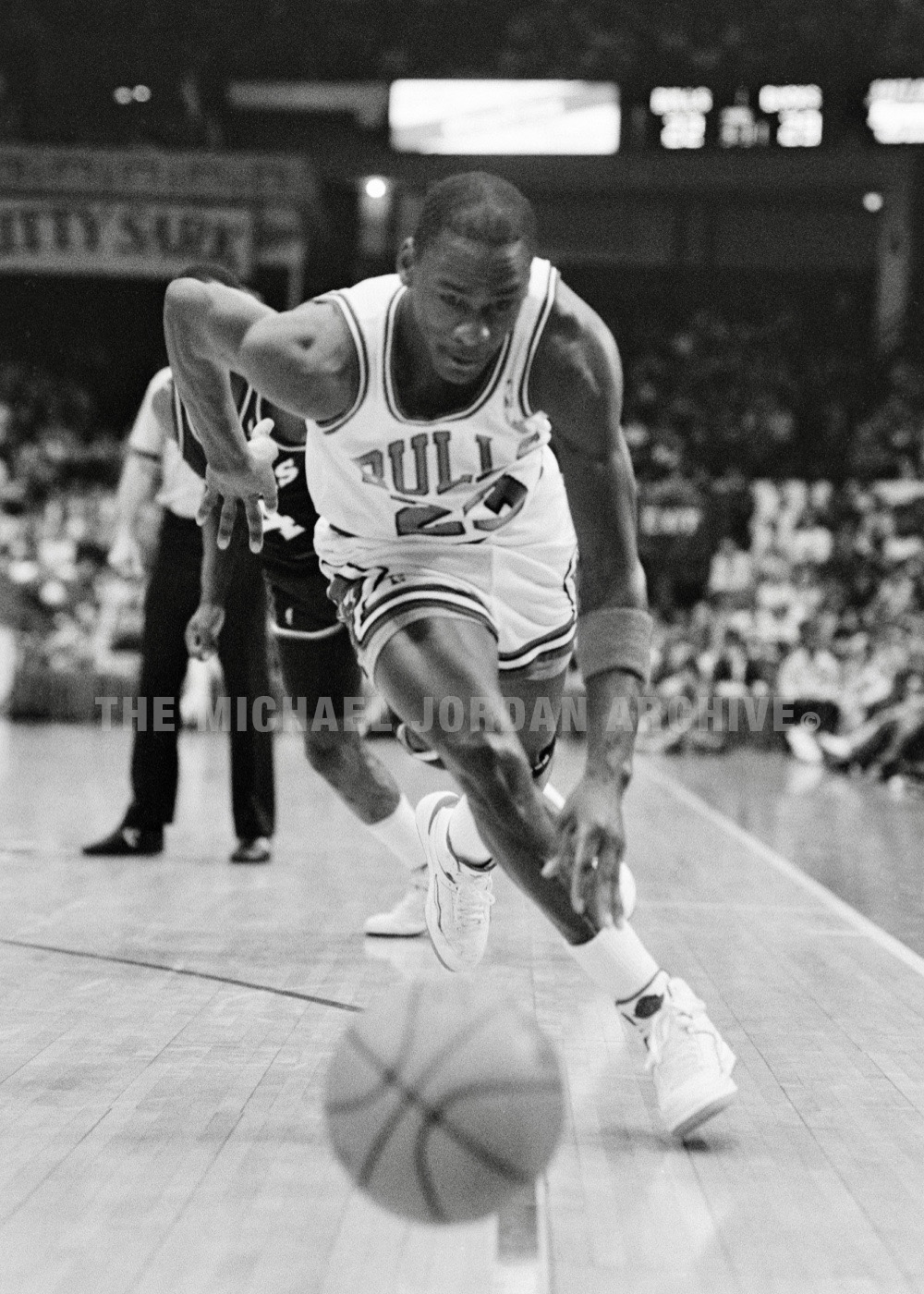 Michael Jordan wearing Air Jordan sneakers during game action versus Milwaukee